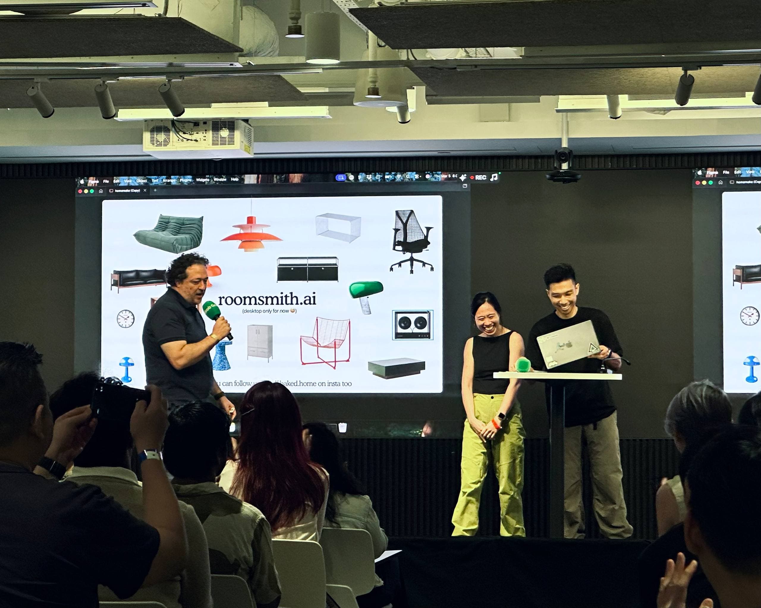 Rachel and Adil presenting Roomsmith.ai on stage